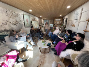 Small room with seated members of the South Chapter of Tennessee Craft holding a chapter meeting.